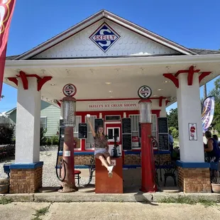 a woman standing at the entrance