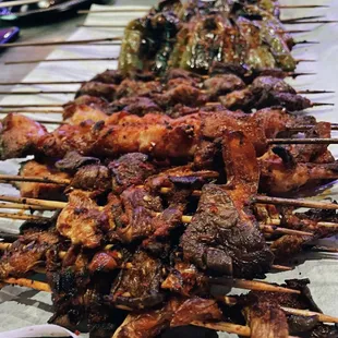a variety of meat on skewers