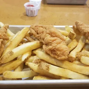 Chicken tenders 3 pieces + French Fries.  Order as a kids&apos; meal with included fountain or bottled drink AND Oreos or apple snack for $15.