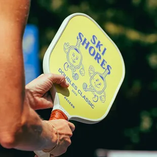 a person holding a paddle paddle