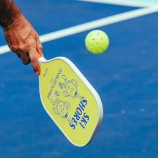 a tennis racket hitting a tennis ball