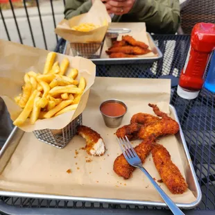 Chicken tenders and fries.