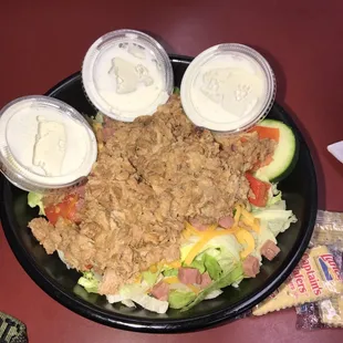 a plate of salad with dressing