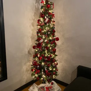 a christmas tree in a corner