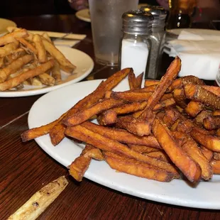 Sides of regular and sweet potato fries