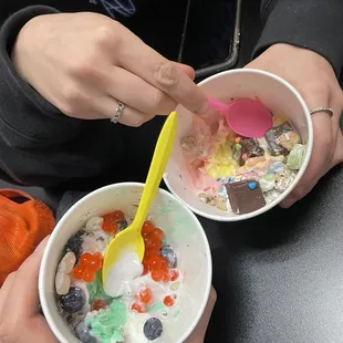 two people eating yogurt