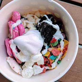 Taro yogurt (would recommend) with fruity pebbles, frosted animal cookies, mochi, white chocolate chips, Oreos, and marshmallow creme.