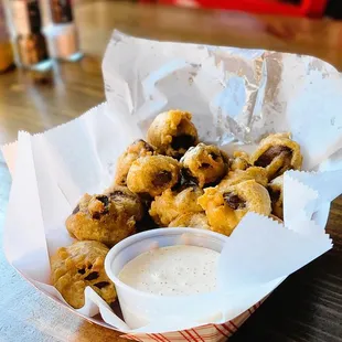 a basket of fried food on a table