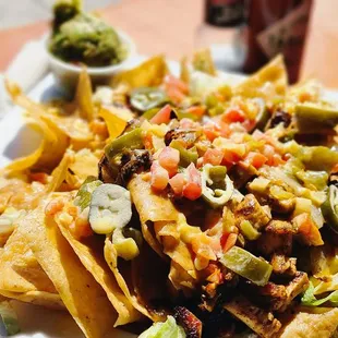 a plate of nachos on a table