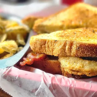 a sandwich and potato chips in a basket