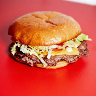 a hamburger on a red table