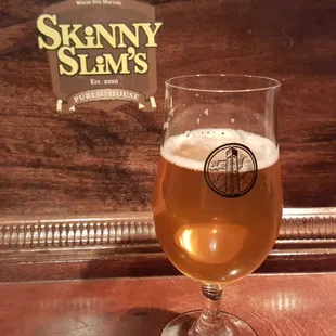 a glass of beer on a table