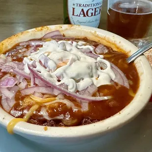 Chili with cheese, sour cream and onions