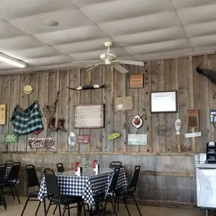 a dining area with tables and chairs