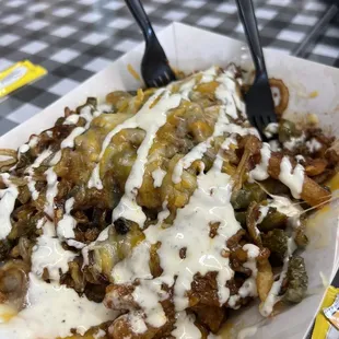 Skinny Fries (topped with chili, cheese, flash fried jalapeños n onions, n ranch)