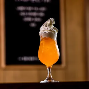 a drink with whipped cream on top