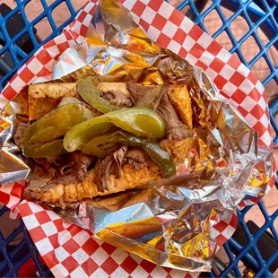 a plate of fries and pickles