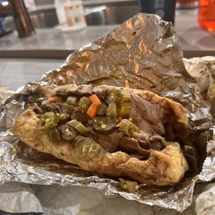 a sandwich wrapped in foil