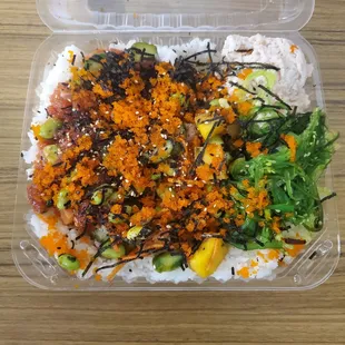 Signature Skipjack Mango sushi rice poke seaweed tobico.