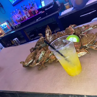 Large blue crabs and a Mango and strawberry margarita