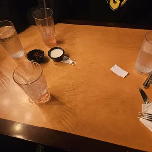 a couple of glasses of water on a table