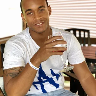 a man holding a glass of wine