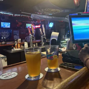 a man using a laptop at a bar