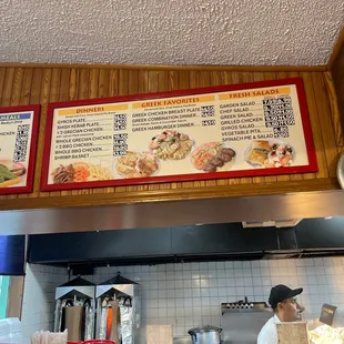 menus on the wall above the counter