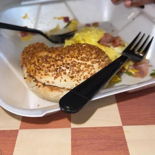 Onion bagel with garlic and herb cream cheese  Sausage bacon egg and cheese Meat Lover's Supreme Omelette