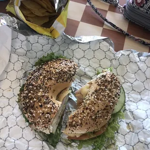 downtown mary jane on an everything bagel, added lettuce and cucumber! lays baked potato chips as my side
