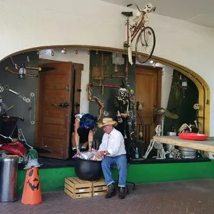 a man sitting in front of a store