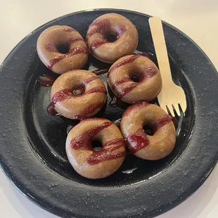 Mini blue corn donuts with berry glaze