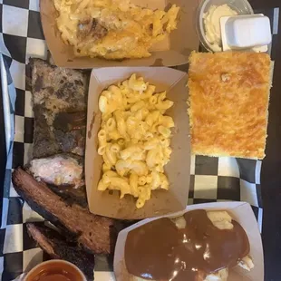 Corn bread, ribs, brisket, Mac and cheese, mashed potatoes, and cheesy hash browns + mango hot sauce