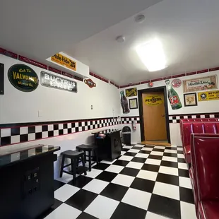 a black and white checkered floor in a diner