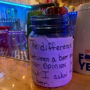 a glass jar with writing on it