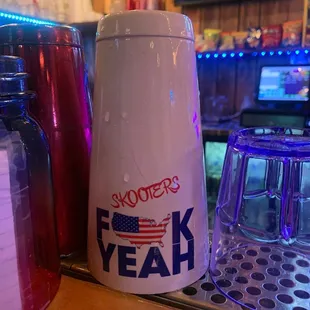 a shot of a shaker and a mug