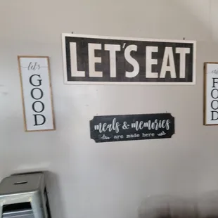 a refrigerator with a sign that says let's eat