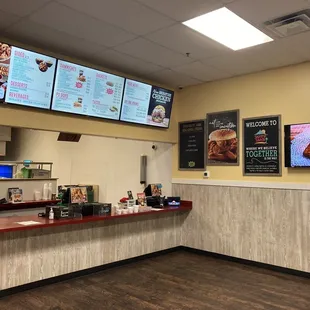 a restaurant counter and menus