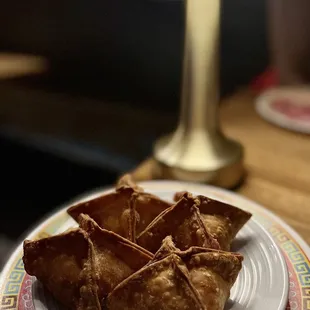 Smoked Fish Rangoon: Wonton Stuffed with Kajiki, Kale and Cream Cheese. Served with Sweet and Sour Sambal Dip. $12