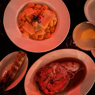 Dinner selections.  Gnocchi and prime rib w bacon wrapped asparagus