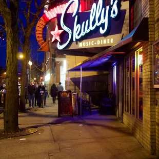 people walking down the sidewalk