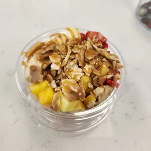 Acai fruit bowl - wild berry &amp; peach Acai twist w/strawberry, banana, pineapple, crunched waffle cone and caramel drizzle.