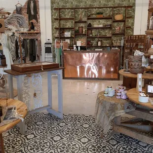 Jewelry, accessories, botanicals near the copper-clad service counter