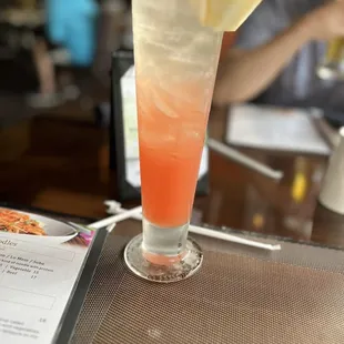 a drink with a slice of pineapple
