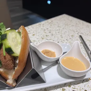 a sandwich and dipping sauce