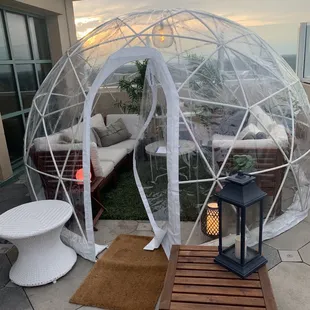 a patio area with a table and chairs