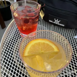 a glass of lemonade and a bowl of lemonade