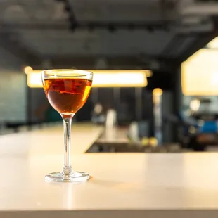 a glass of wine on a counter