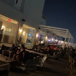 people sitting outside at night