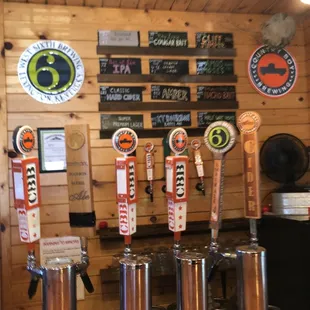a row of beer taps